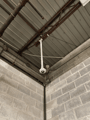 Pendant camera in a warehouse bay.