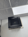 Wall-mount cabinet above the ceiling line.